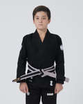 Kingz The ONE V2 Kids BJJ Gi Black - Front View Young Athlete Black Gi White Crown Logos Gray Belt Kingz Text Chest and Pants Durable Fabric BJJ Gi Training [color:Black]