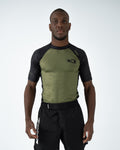 Kingz Krown S/S Rashguard Green - Full Body Front View Male Athlete Black Sleeves Olive Green Chest K Crown Logo Left Chest KINGZ Text Right Shoulder Athletic Fit BJJ No-Gi Rash Guard [color:Green]