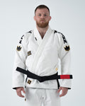 Kingz Comp 450 V6 Gi - White - Front View Male Athlete Black Belt Gold Crown Shoulder Patches Black KINGZ Text Sleeves Embroidered Logo Chest Durable Weave Jiu Jitsu Gear [color:White]