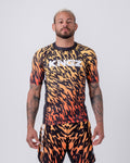 Kingz Flame Rashguard Orange Black - Full Body Front View Male Athlete Short Sleeve Flame Tiger Stripe Pattern Orange Yellow Black Ombre Sublimated KINGZ White Text Chest Matching Flame Pattern Shorts Grappling BJJ MMA No-Gi [color:Black/Flame]