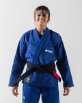 Kingz Balistico 3.0 Women's Jiu Jitsu Gi Blue - Full Body Front View Female Athlete Blue Gi White KINGZ Chest Logo Crown Badge Hem Black Belt Contrast Stitching BJJ Training Gear [color:Blue]