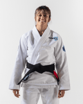 Kingz Nano 2.0 Womens Jiu Jitsu Gi - White - Front View Smiling Female Athlete White Gi Black Belt Blue Logo Shoulder Patch Durable Fabric BJJ Training Gi [color:White]