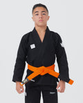 Kingz Kore V2 Youth BJJ Gi Black - Upper Body Front View Teen Athlete Orange Belt Crown Logo KINGZ Patch 380gsm Youth