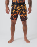Kingz Flame Shorts Orange Black - Full Body Front View Male Athlete Bold Orange Black Tiger Flame Sublimated Print Grappling Shorts Competition Cut KINGZ KIMONOS Black Waistband Crown Logo Right Thigh Matching Flame Print Rashguard Bare Feet Men's No-Gi BJJ [color:Black/Flame]