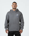 Grey BJJ hoodie front view on adult male model showing Pursue The Gentle Art rose chest graphic [color:Grey]