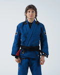 Kingz Ultralight 2.0 Women's Jiu Jitsu Gi Blue - Full Body Front View Female Athlete Blue Gi Black Belt Crown Logo Sleeves Embroidered Text Chest Durable Lightweight Design BJJ Gi Training [color:Blue]