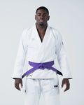 Kingz Kore V2 Jiu Jitsu Gi - White - Front View Male Athlete White Gi Black Belt Kingz Logo Left Hem Crown Badge Left Arm Traditional Cut Durable Fabric BJJ Gi Training [color:White]