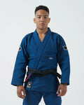 Kingz Ultralight 2.0 Jiu Jitsu Gi Blue - Front View Male Athlete Black Belt Blue Fabric Crown Badge Sleeve Embroidered Ultralight Text Chest Black Label Hem BJJ Gi Training [color:Blue]