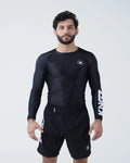 Kingz Kore V2 Long Sleeve Rashguard Black - Full Body Front View Male Athlete Black Rashguard White KINGZ Sleeve Text Crown Logo Chest Snug Fit BJJ No-Gi Grappling Rash Guard [color:Black]
