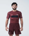 Kingz Trooper Rashguard Maroon - Full Body Front View Male Athlete Short Sleeve KINGZ Logo Black Chest Band Flag Patch Sublimated Graphics [color:Maroon]