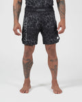 Kingz Acid Wash Shorts Black - Full Body Front View Tattooed Male Athlete Black White Dot Acid Wash Pattern KINGZ Bold Waistband Text KINGZ Large Left Leg Text Crown Badge Right Thigh Competition Cut Men's Grappling Shorts No-Gi BJJ [color:Black/Patterned]