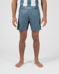 Kingz Vintage Futebol Shorts Light Blue - Full Body Front View Male Athlete Steel Blue Color Kingz Kimonos Script Waistband Text Soccer Inspired Competition Cut Shorter Hemline Men's Grappling Shorts No-Gi BJJ [color:Light Blue]