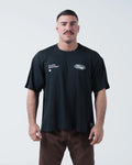 Kingz JJ Dept Tee - Front View - Jiu Jitsu Department Oval Badge Dual Chest Graphics - Black BJJ Tee [color:Black]