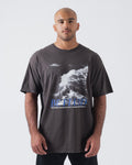 Kingz Be Fluid Tee Charcoal - Front View Male Athlete Ocean Wave Graphic Large Blue BE FLUID Text Relaxed Fit Crew Neck Streetwear [color:Charcoal]