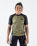 Kingz Krown S/S Rashguard Olive - Full Body Front View Female Athlete Olive Black Contrast Panels Crown Logo Chest KINGZ Text Shoulder Short Sleeve BJJ Training Rash Guard
