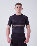 Kingz Relentless S/S Rashguard Black - Full Body Front View Male Athlete Black Crown Logo Left Chest Relentless Text Chest Subtle Textured Pattern Short Sleeve BJJ No-Gi Grappling Rash Guard